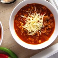 tomato soup with beef, corn and cheese