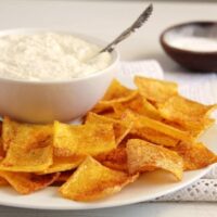 polenta chips on a plate and a bowl with dip.