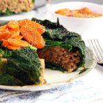 stuffed cabbage cake with savoy cabbage and caramelized carrots on top