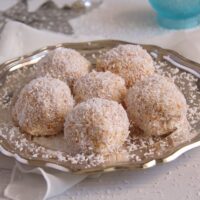 cake balls with coconut and pineapple on a plate