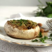 vegetarian stuffed mushroom on a plate close up