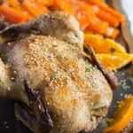 pot roast chicken with oranges and roasted carrots.