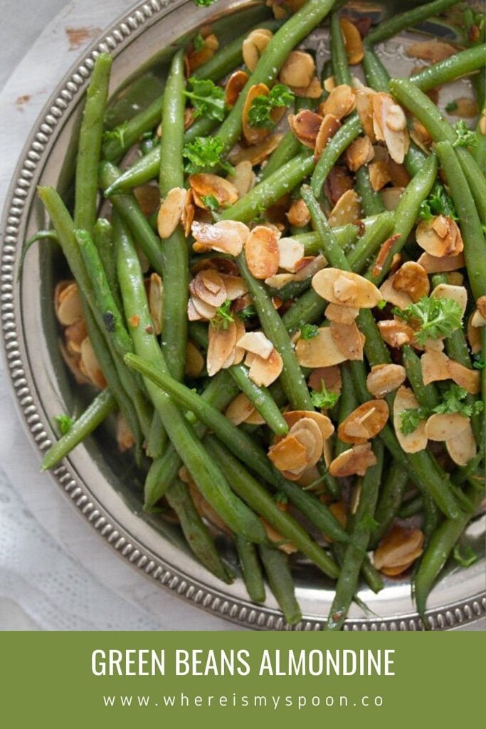 buttered green beans amandine on a silver plate close up