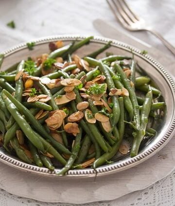silver plate with green beans almondine