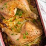 one pan chicken and potatoes in a pink casserole dish
