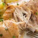 fall-off the bone chicken quarters served with potatoes dauphinoise