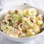 no mayo sour cream potato salad in a bowl.