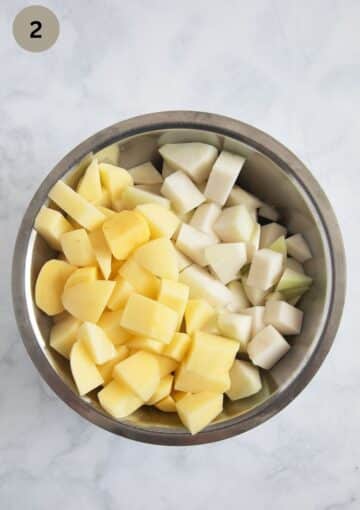 potato and kohlrabi cubes in a bowl for making soup.
