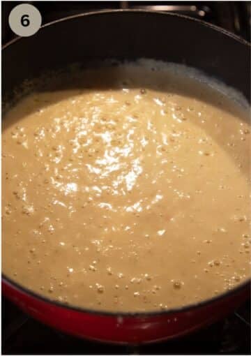 blended kohlrabi soup with potatoes in a soup pot.