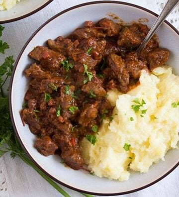 bowl with goulash and mashed potatoes