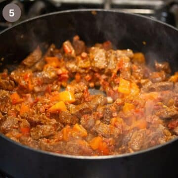 cooking beef goulash in a large pot. 