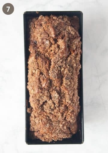 baked rhubarb blackberry cake in a loaf pan.