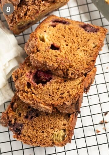 slices of blackberry rhubarb cake on a wire rack.