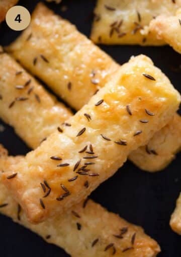 cheesy crackers sprinkled with caraway seeds.