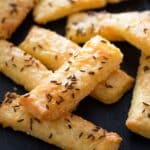 romanian saratele sprinkled with caraways seeds and cheese.