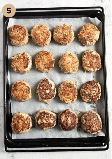 turkey meatballs without breadcrumbs on a baking sheet before baking.