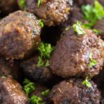 close up of turkish meatballs sprinkled with parsley
