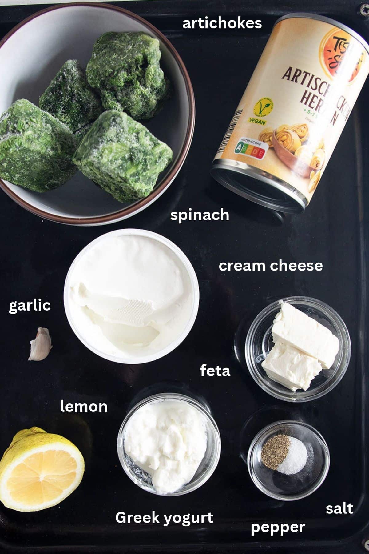labeled ingredients for making dip with artichoke, spinach, cream cheese, and feta.