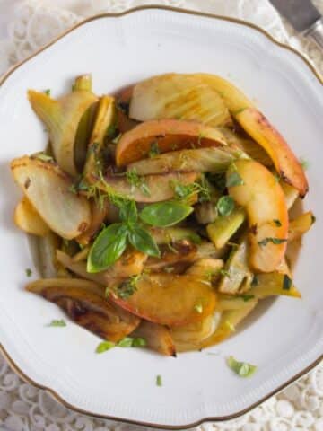 overhead view of a plate of braised fennel with apples.