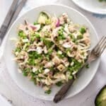 plate with tuna feta salad with a fork on it.