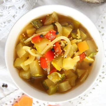 canned pickled zucchini in a small bowl.