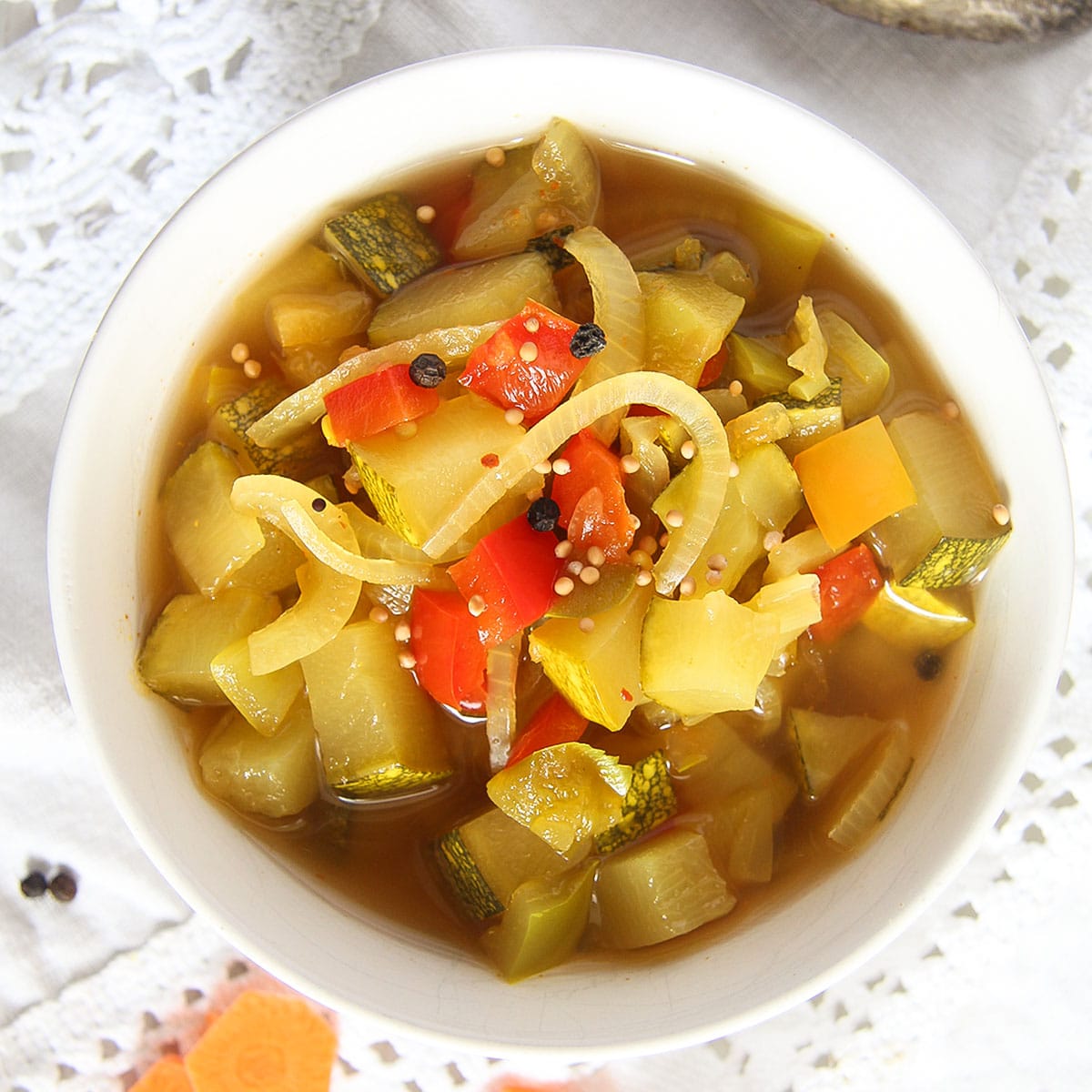 canned pickled zucchini in a small bowl.