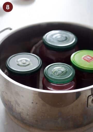for jars of cherry butter in a pot ready for canning.