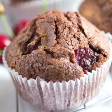 one chocolate cherry muffin with the paper liner on.