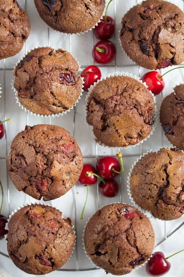 cherry muffins on a wire rack