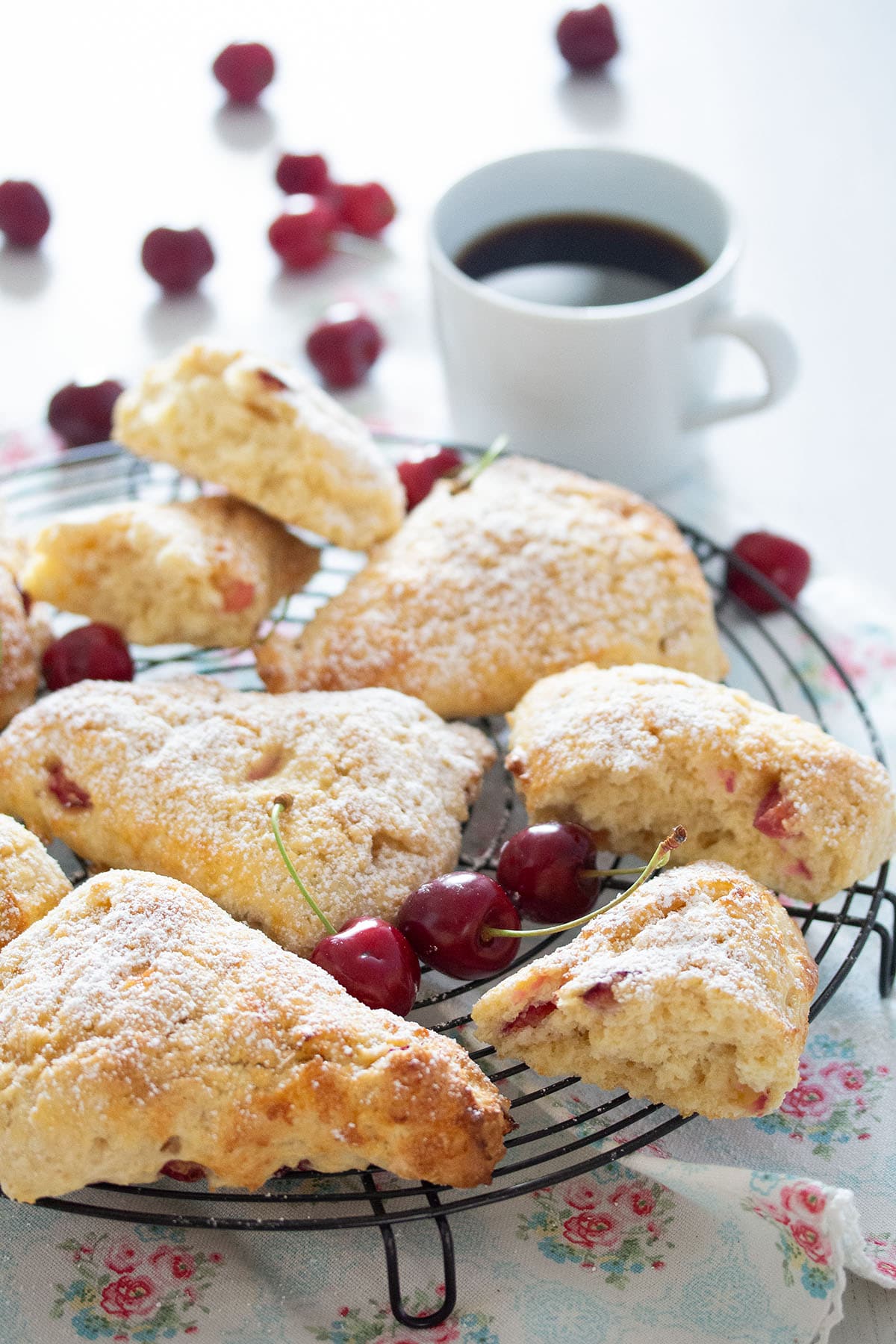 cherry scones served with a cup of coffee.