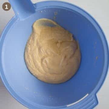 making the batter for cherry dessert in a large bowl.