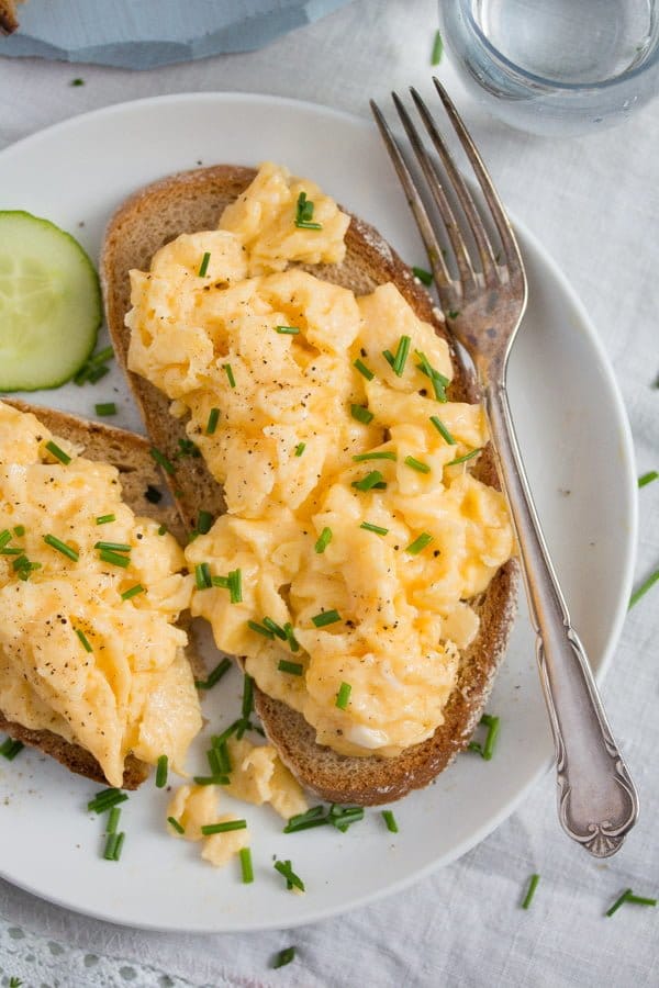 plate of scrambled eggs on toast
