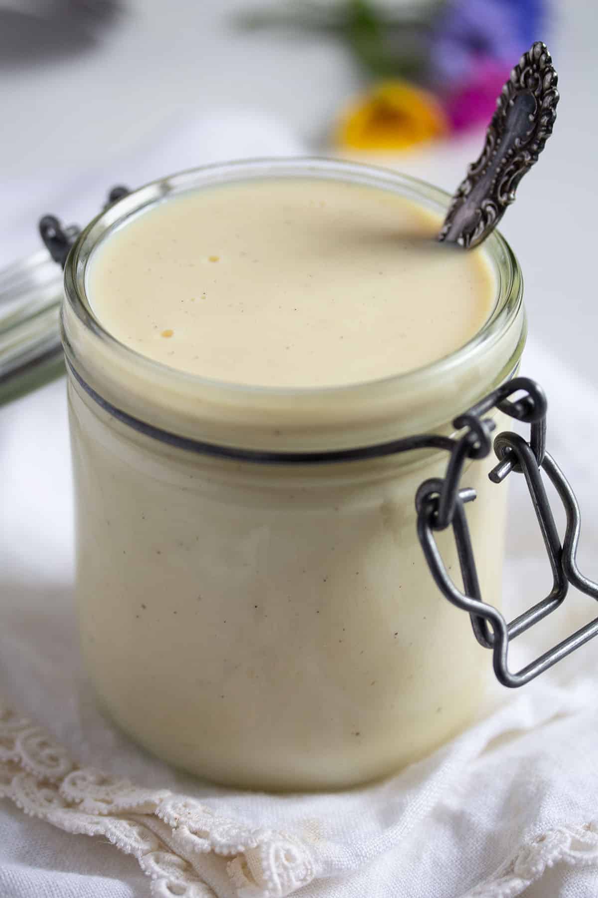 german vanilla sauce with a spoon in it in a jar.