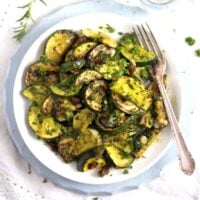 zucchini with pesto on a plate.