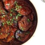 pinterest image of aubergines in tomato sauce.