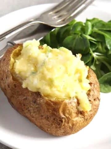 cheese jacket potato served with salad.