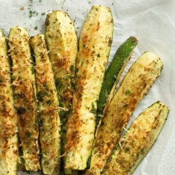 roasted zucchini wedges sprinkled with parmesan and spices.