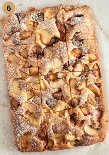 cut cake with peaches on the table.