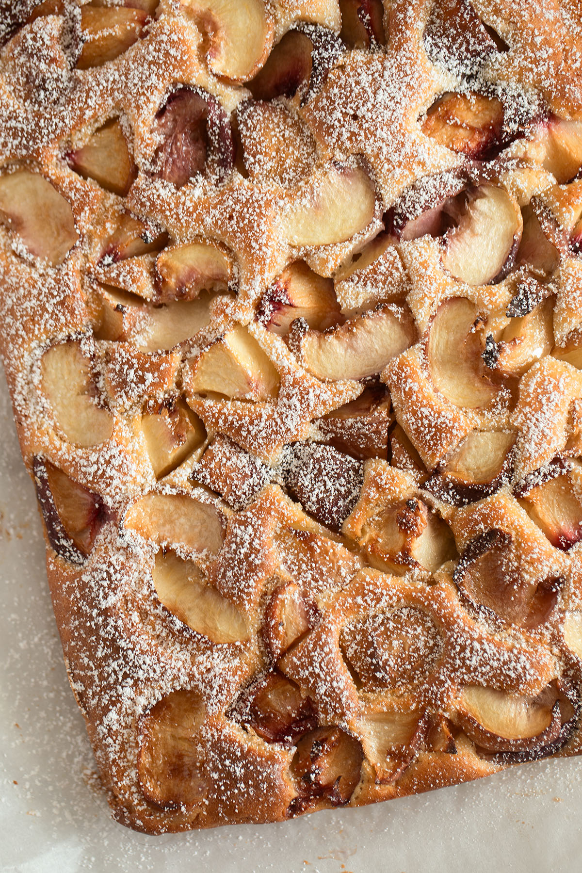 peach sour cream cake sprinkled with sugar.