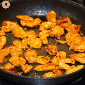 frying chicken strips with gochujang sauce in a pan.