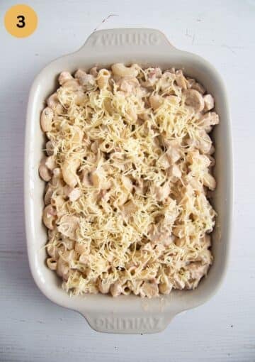 unbaked pasta bake with leftover chicken in a baking dish.