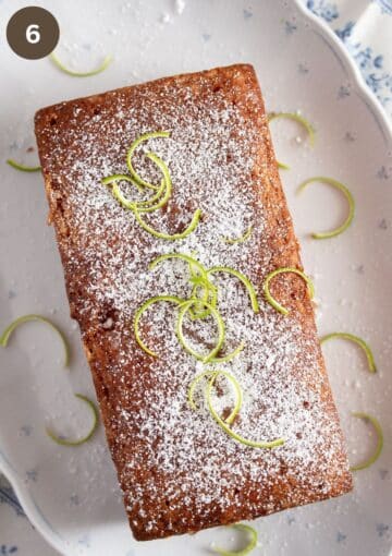 loaf cake drizzled with lime drizzle, sprinkled with icing sugar and decorated with lime zest. 