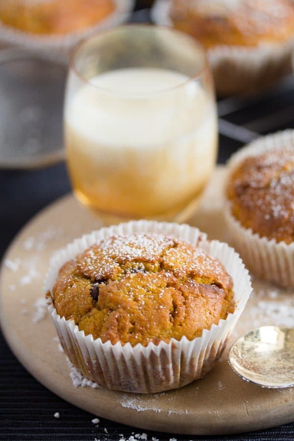 chocolate chip pumpkin muffins with a glass of milk