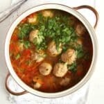 turkey meatball vegetable soup in a vintage soup pot with golden handles.