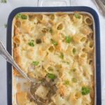 pinterest image of pasta bake with turkey and white sauce.