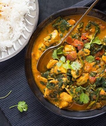 serving chicken saag with rice