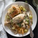 coq au riesling with mushroom and grapes served over pasta.