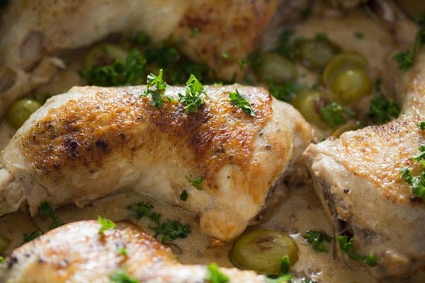 close up chicken legs with riesling sauce