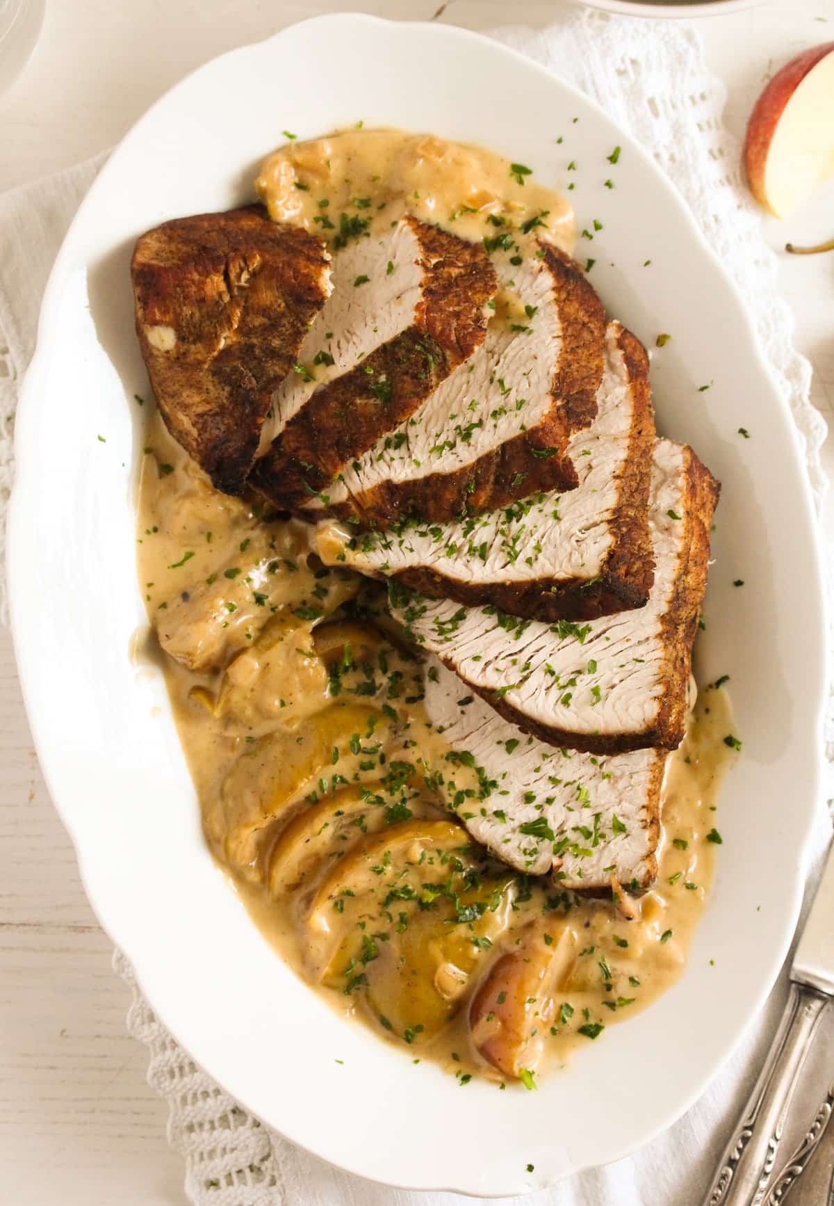 overhead view of sliced turkey with apples.