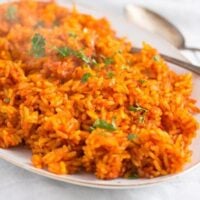 spicy nigerian jollof rice on a serving platter.